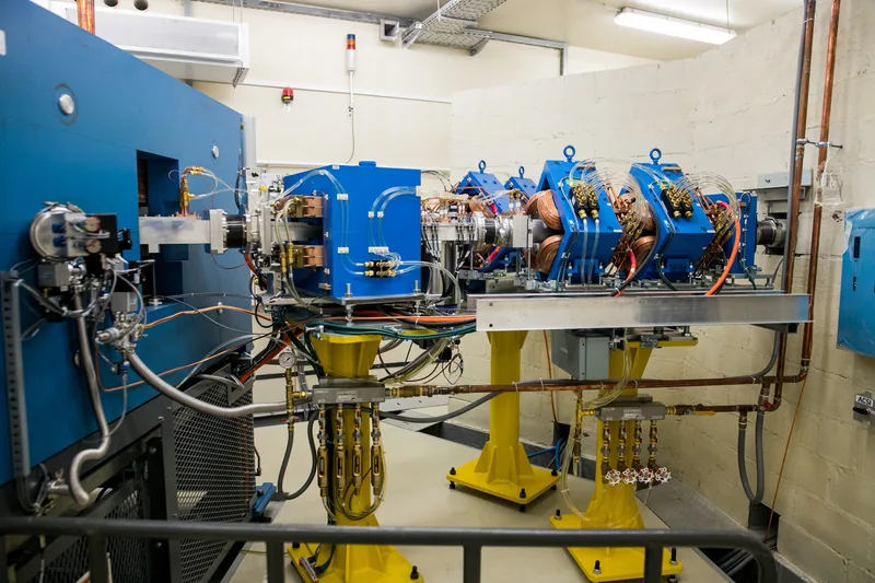 Cyclotron beam line with magnets, piping, and instrumentation