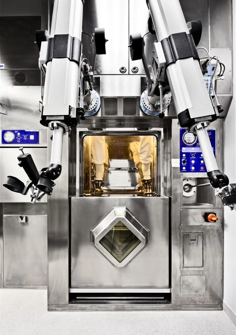 Shielded hot cell with viewing window and remote handling equipment